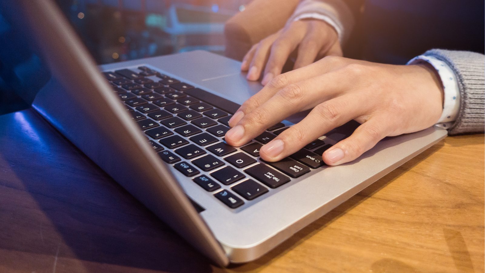 A financial advisor working at a laptop.