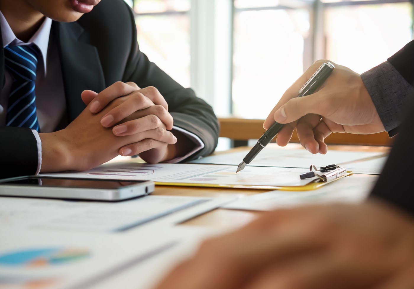 An advisor talking through financial information with a client.